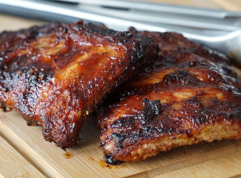 ribs with barbeque sauce on them