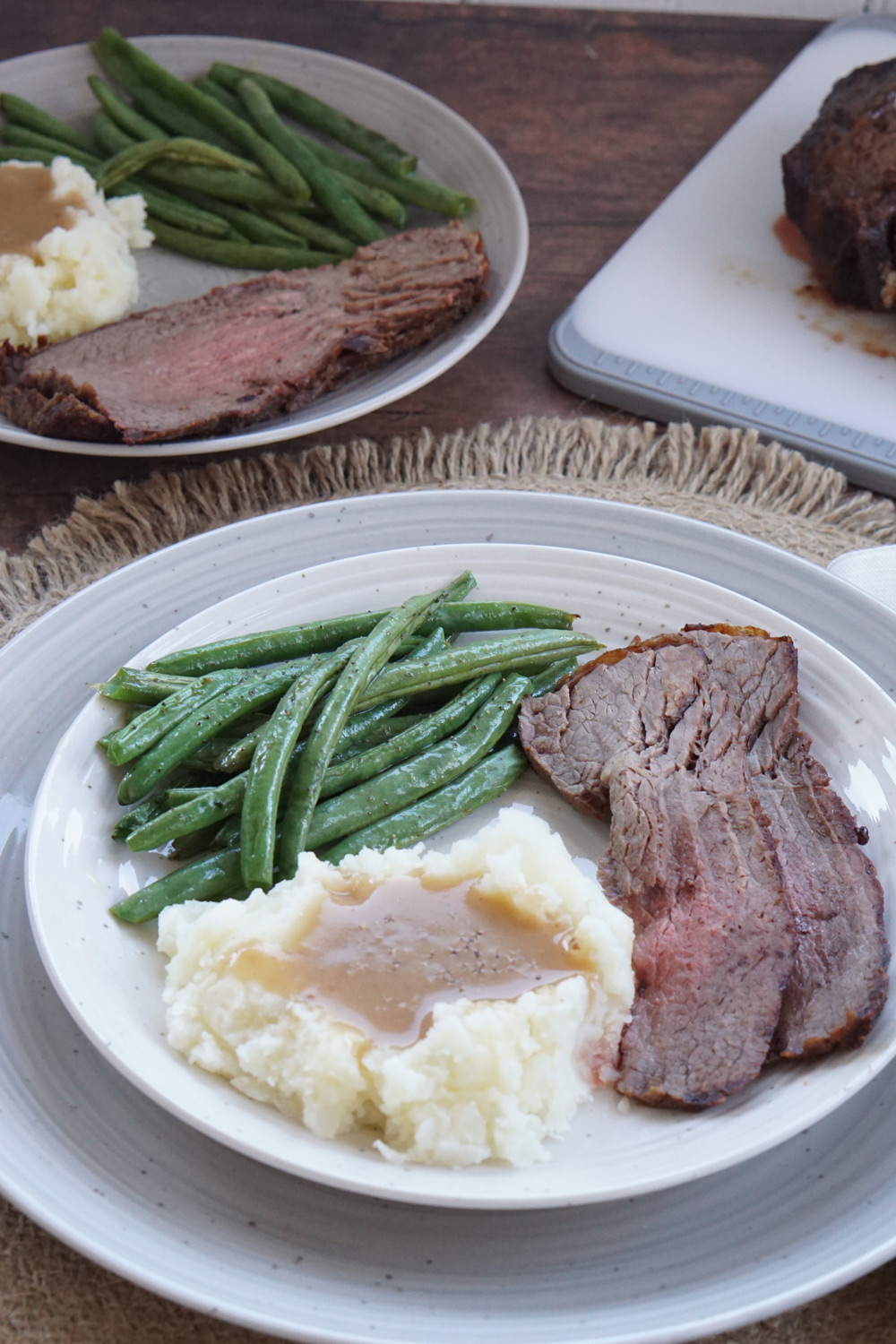 Sliced beef roast with green beans and mashed potatoes