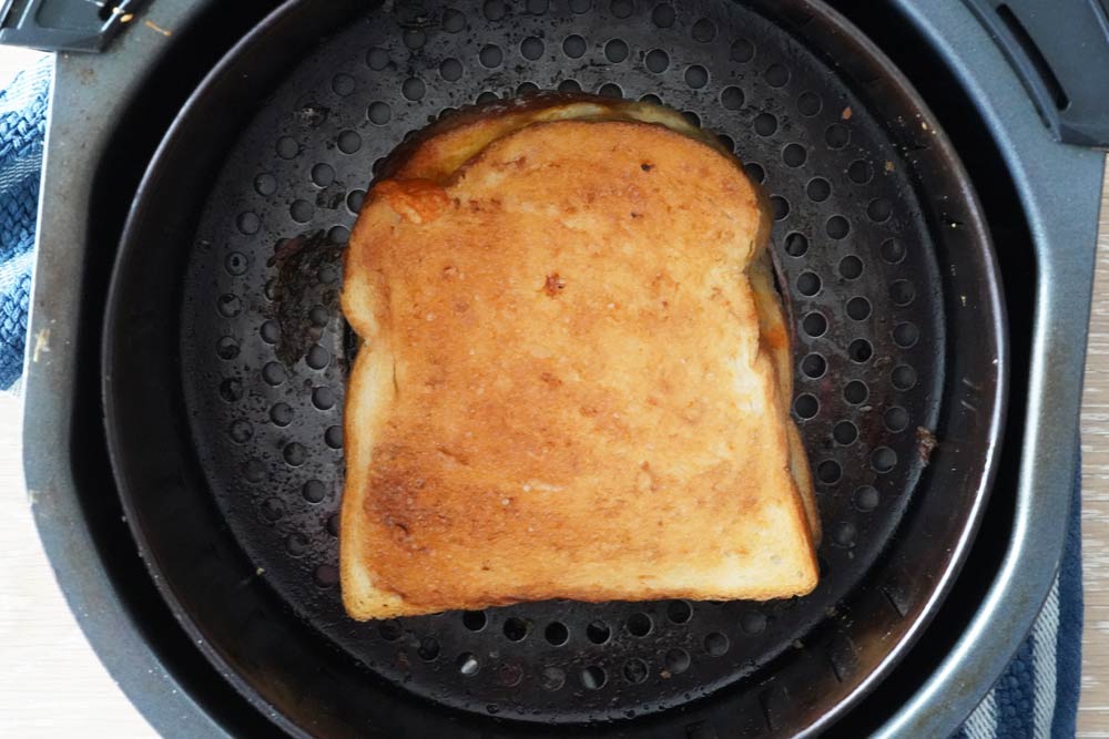 Cooked sandwich in the air fryer basket