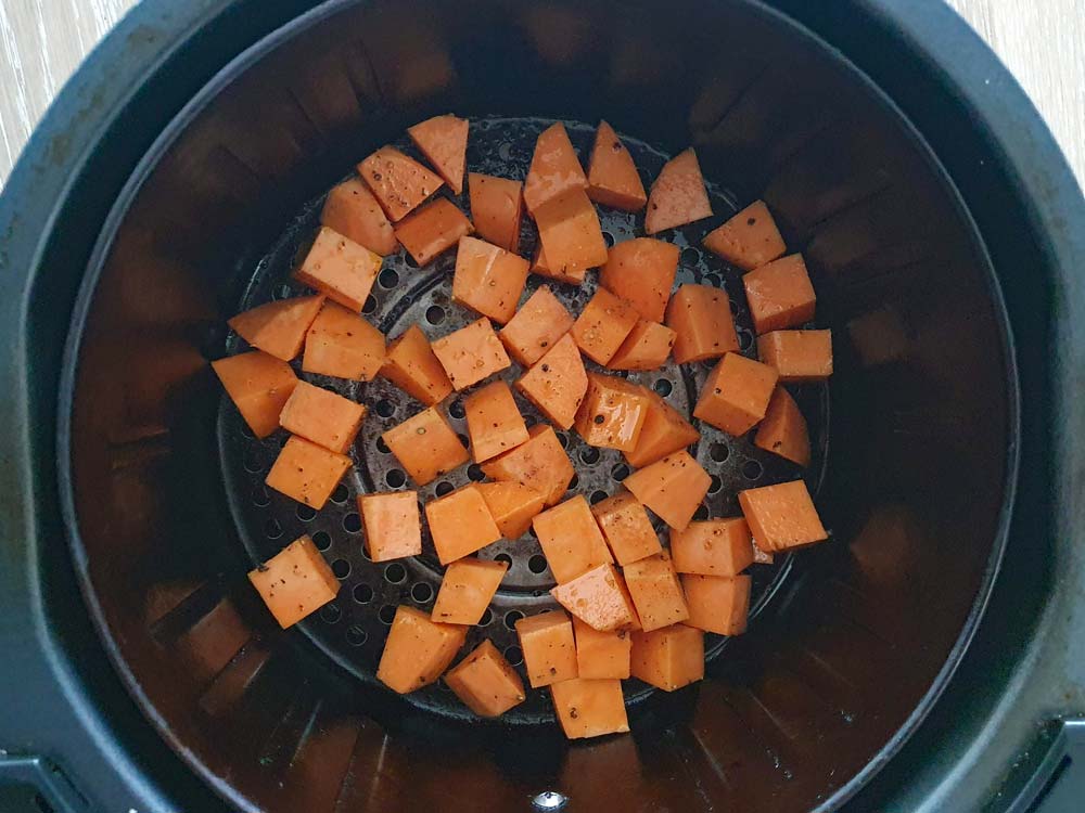 Sweet potato cubes in the air fryer basket