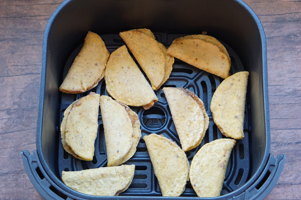 Frozen mini tacos in the air fryer basket