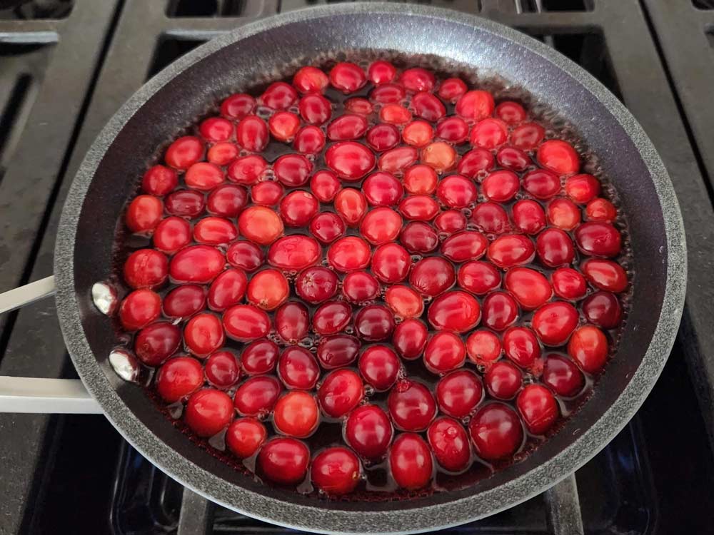 Cranberries in a pan on the stove