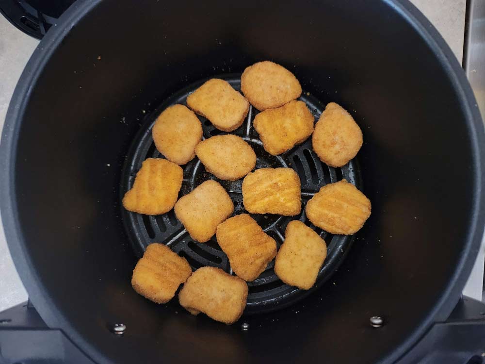 Chicken nuggets in the air fryer basket