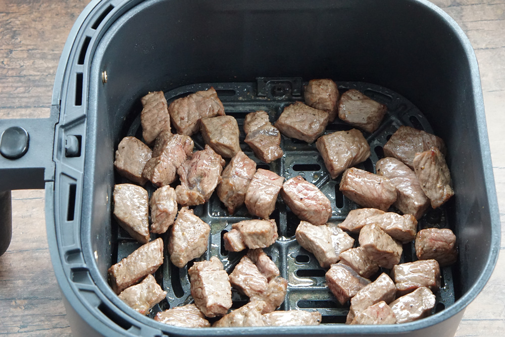 cooked Steak tips in the air fryer basket