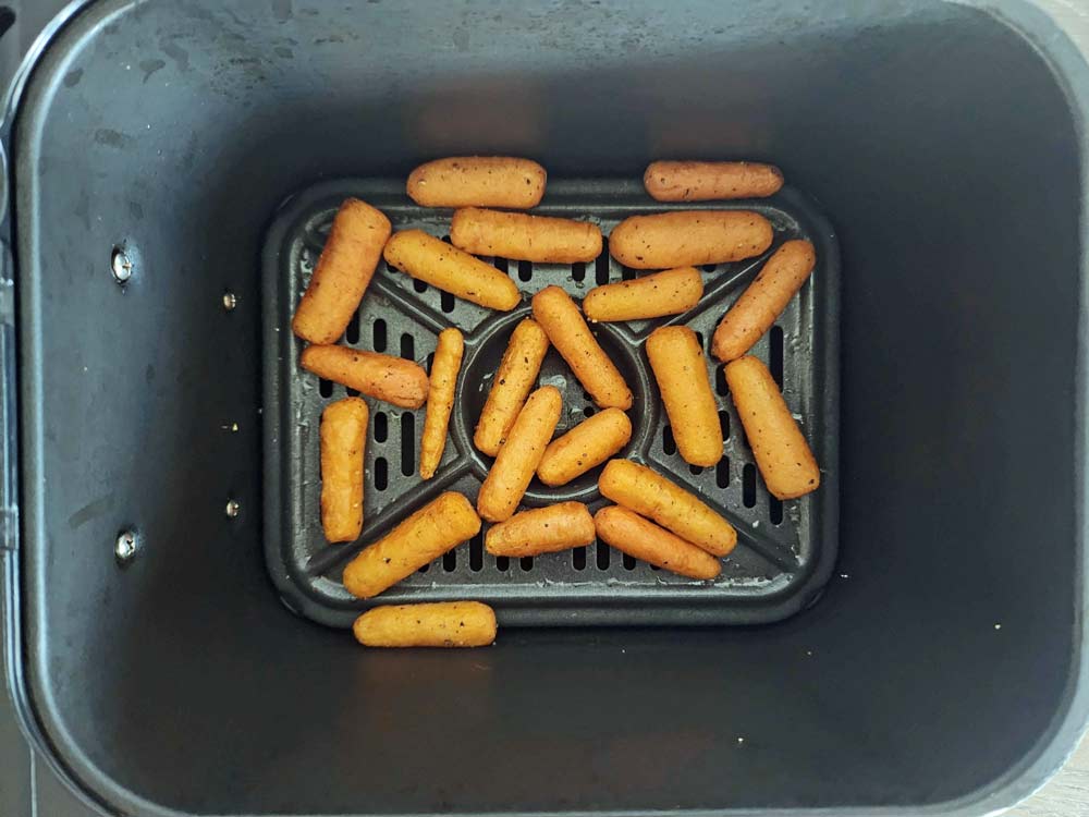 cooked carrots in the air fryer basket